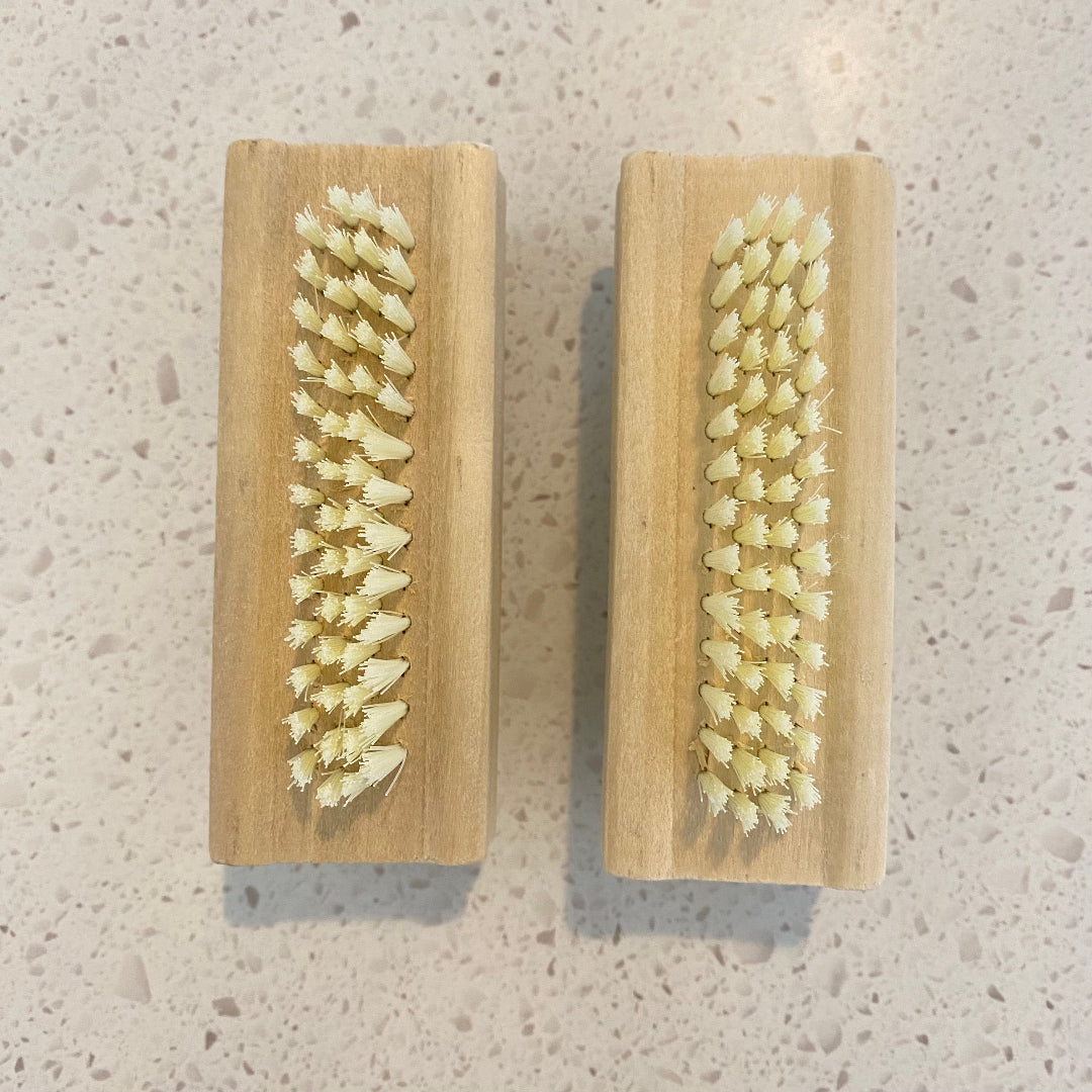Eco Fox bamboo double-sided nail brush showing the front bristles for cleaning nails.