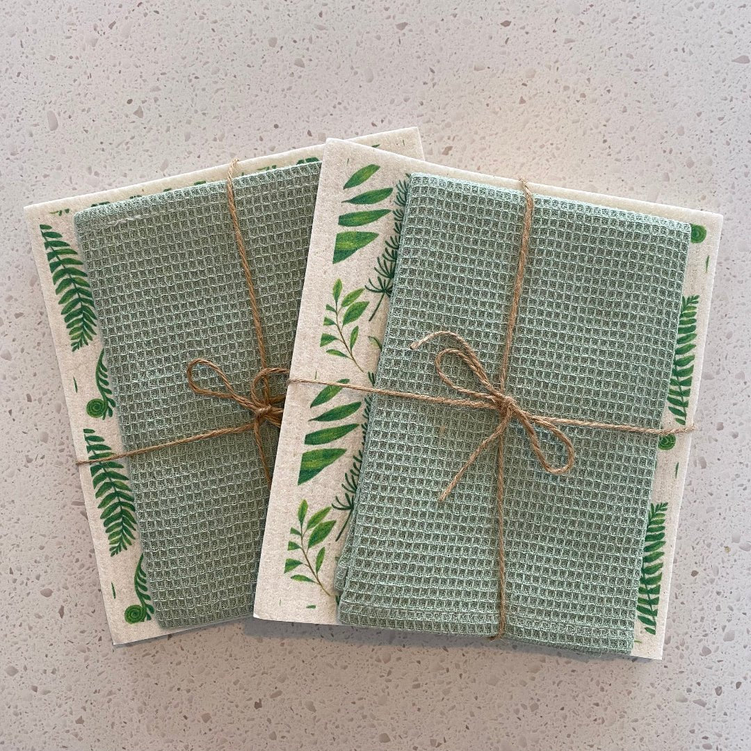 Styled eco-friendly kitchen set with dishcloths and towel displayed on a countertop