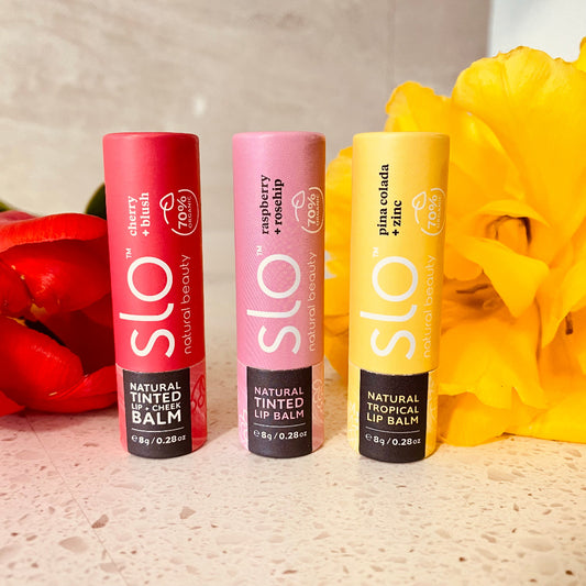 hree Eco Fox natural lip balms arranged side by side - Cherry + Blush, Raspberry + Rosehip, and Pina Colada + zinc - on a clean flatlay background.