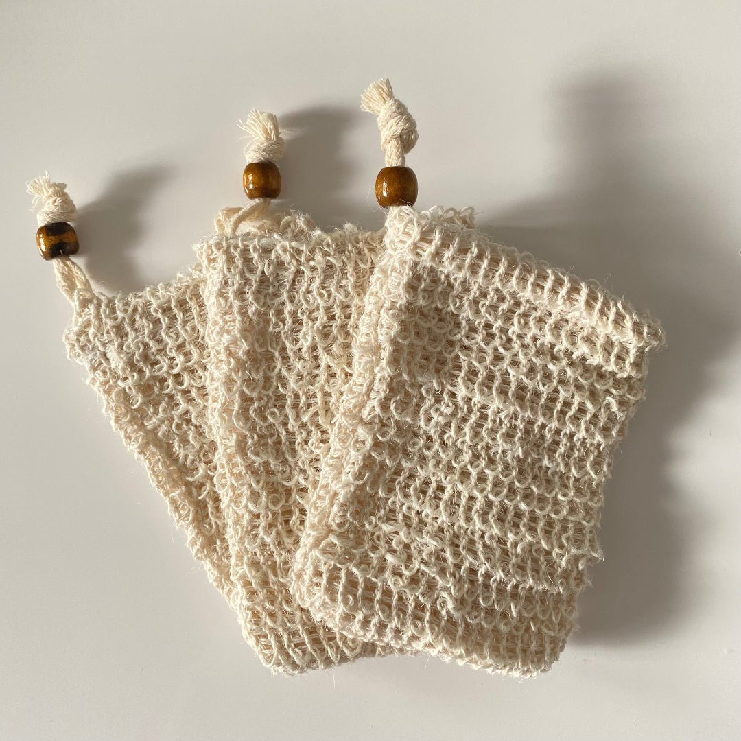 Eco-friendly natural soap saver bag with drawstring for a zero-waste bathroom