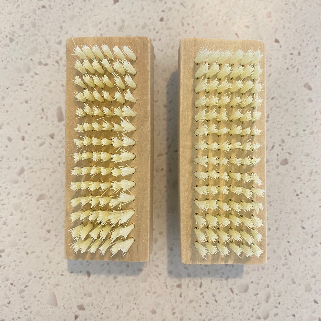 Eco Fox bamboo double-sided nail brush showing practical use and size.