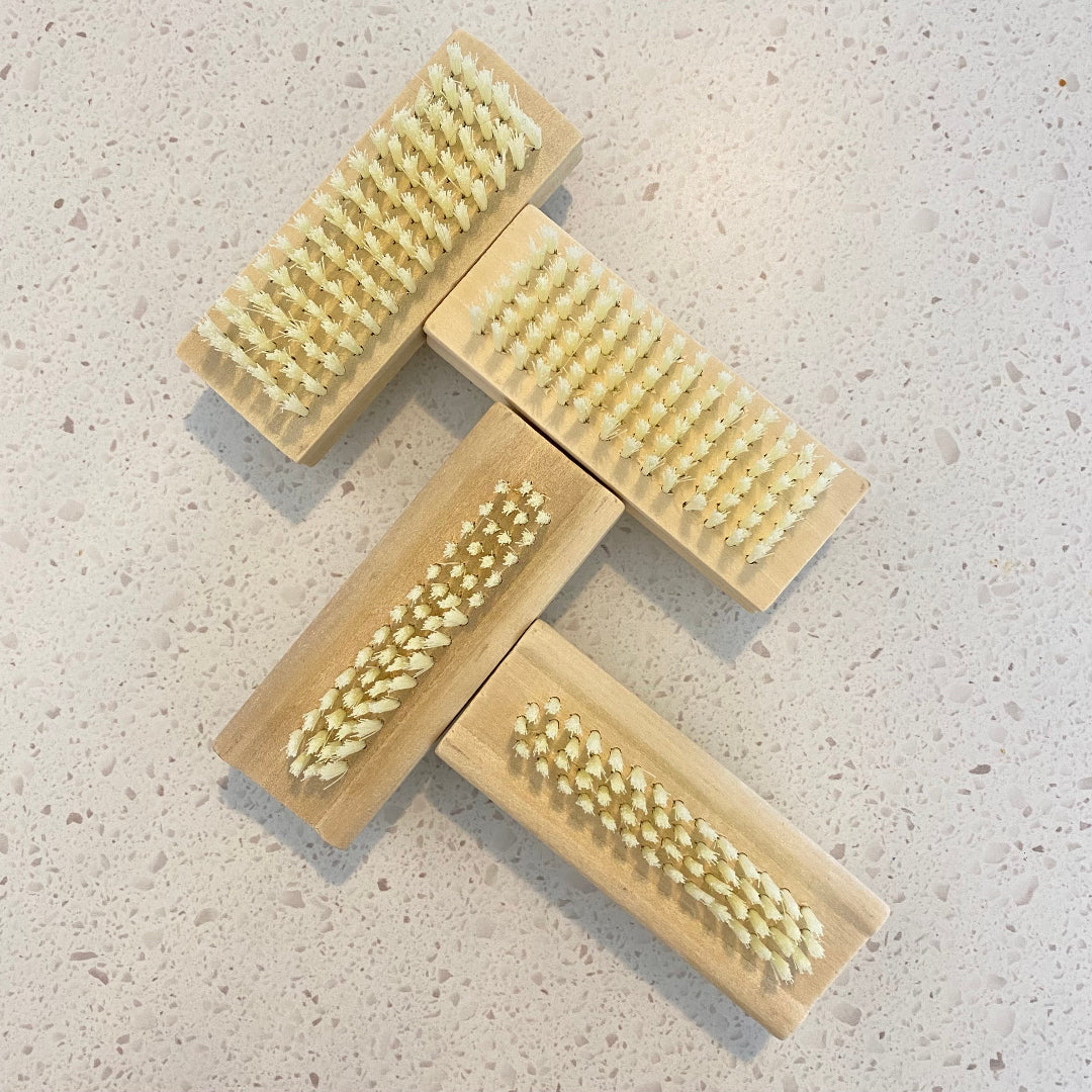 Eco Fox bamboo double-sided nail brush showing the front bristles for cleaning nails.