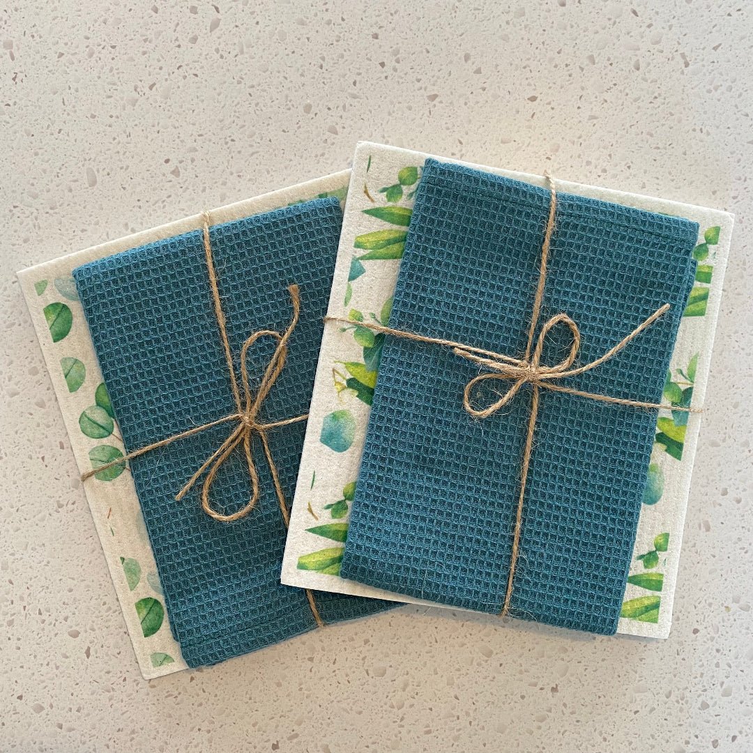 Styled eco-friendly kitchen set with dishcloths and towel displayed on a countertop