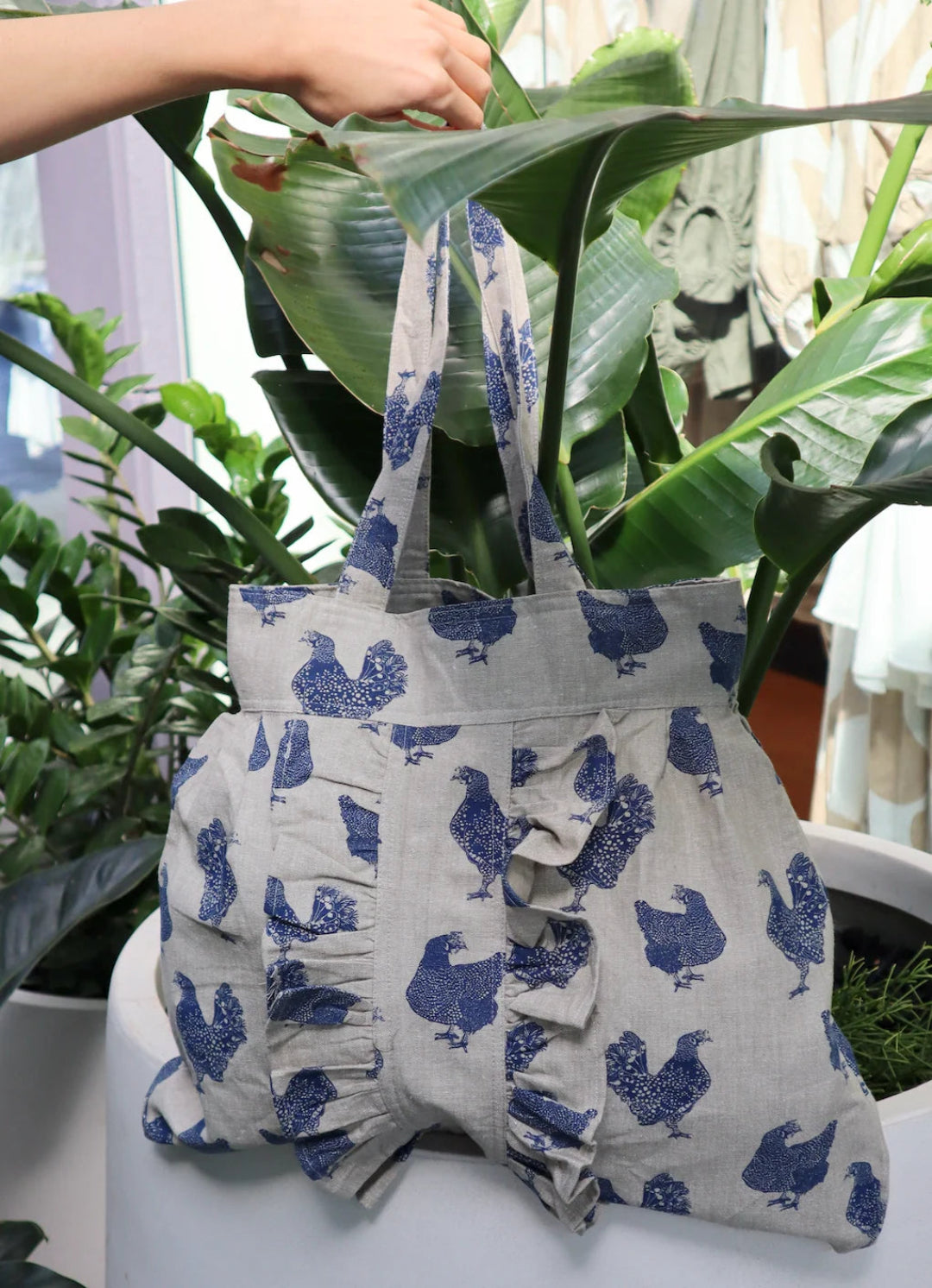 Lifestyle photo of the Henrietta Shopping Tote Bag – Blueberry modeled over the arm, perfect for markets or shopping trips.