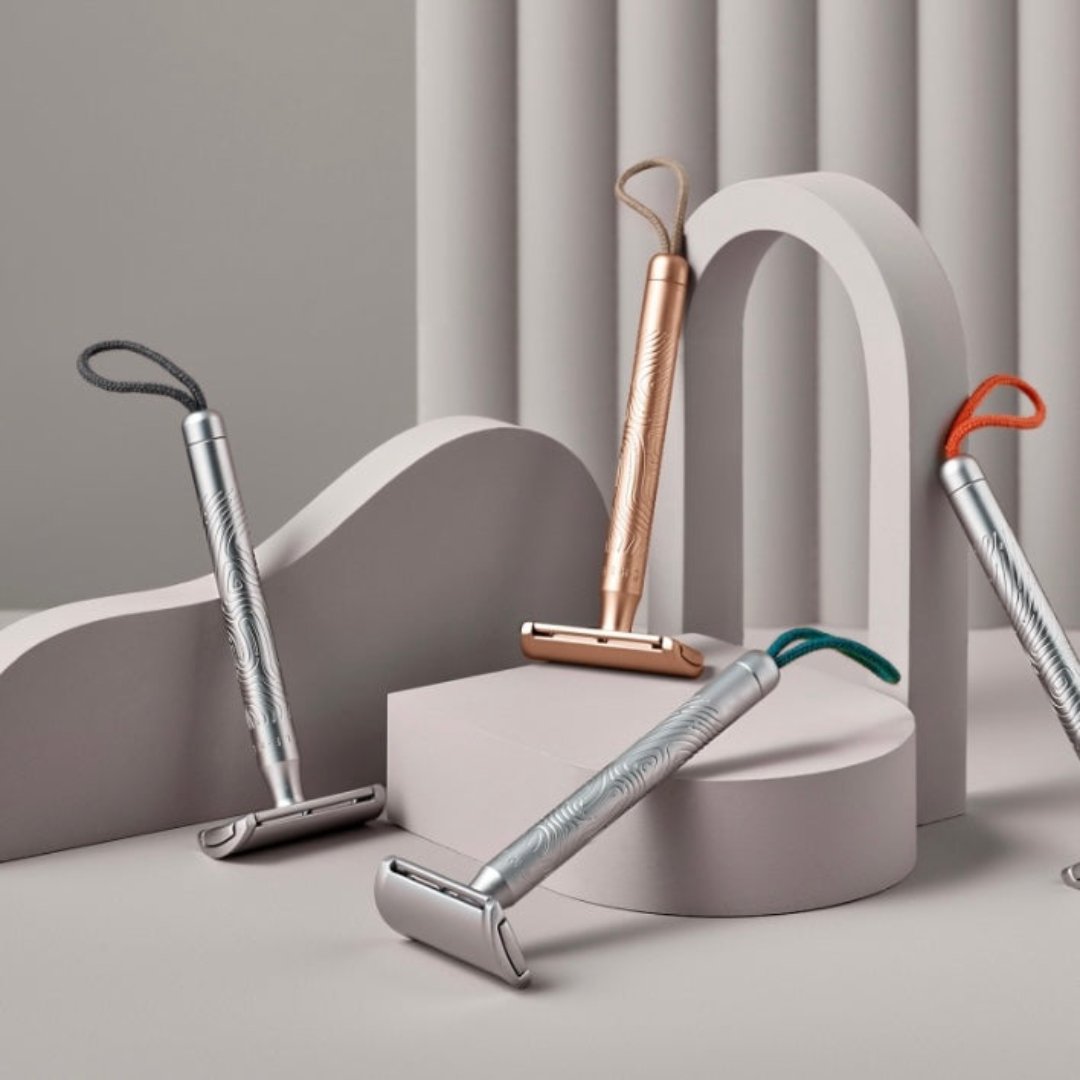 Eco-friendly COMPANION safety razor with replaceable coral cord, sustainable metal finish, and plastic-free packaging for zero-waste shaving.