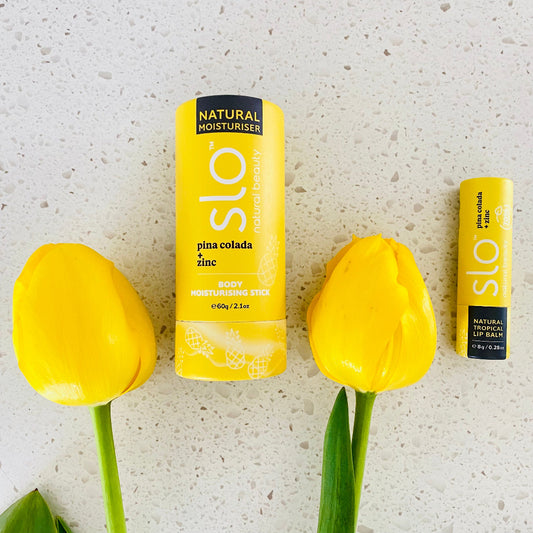 Natural Island Glow Duo – Slo Naturals Pina Colada Body Moisturising Stick and Pina Colada Lip Balm in tropical pineapple and coconut scents, vegan and cruelty-free.